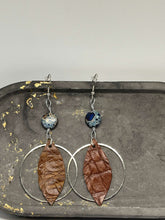 Load image into Gallery viewer, Beaded Earrings - Feather in a Hoop (Brown and Marbled Blue)
